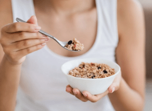 FoodanHealth 15 eating-scoop-of-oatmeal