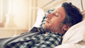 A Middle aga man taking a Nap