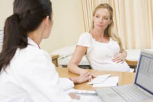 A Medical Personnel attending to a Pregnant woman